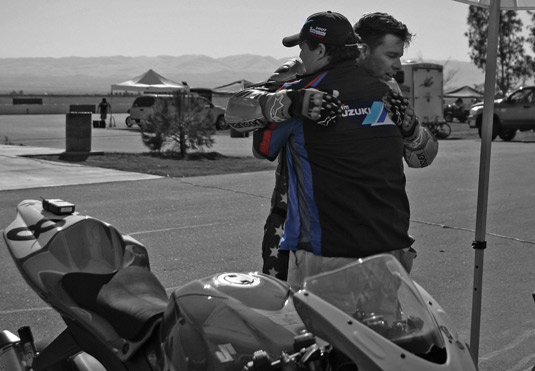 Brad Hakala and GoGo hug after trimuph